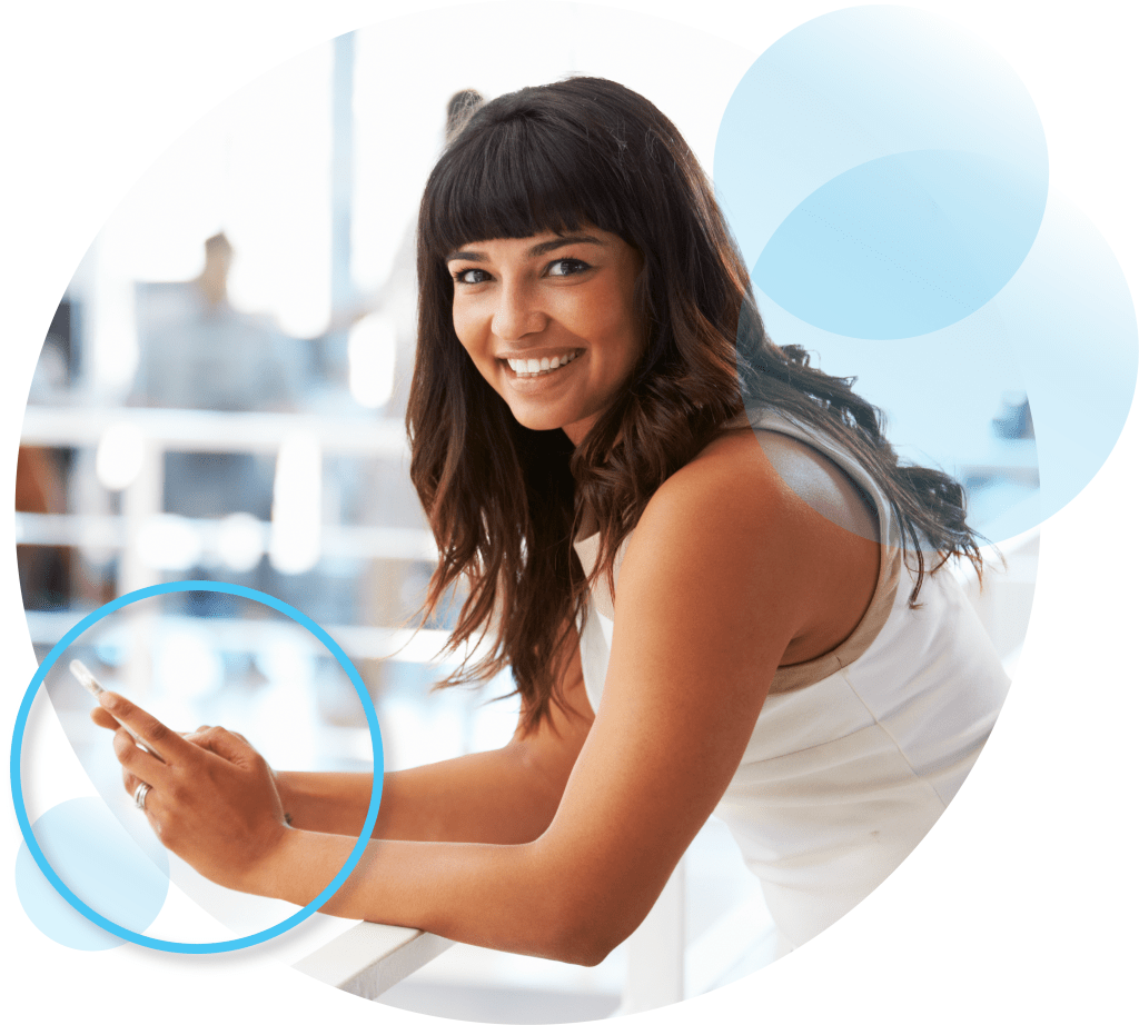 Woman smiling with phone in her hand